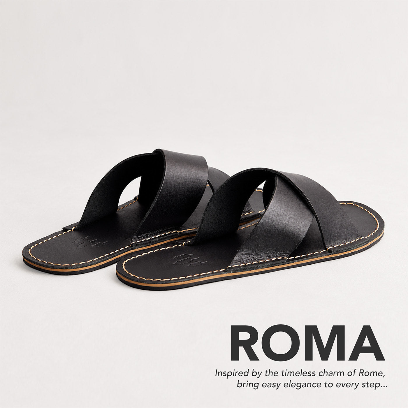 Nero | Flat leather sandals with debossed PLG three tree logo in sole, text reads "Roma. Inspired by the timeless charm of Rome, bring easy elegance to every step..."