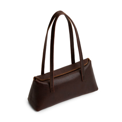 Coldbrew | Leather bowler bag with magnetic closure against a white background