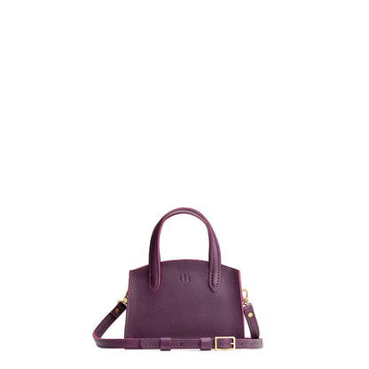 Plum*Mini | Leather tote bag with handles, adjustable crossbody strap, zipper top, and a back pocket