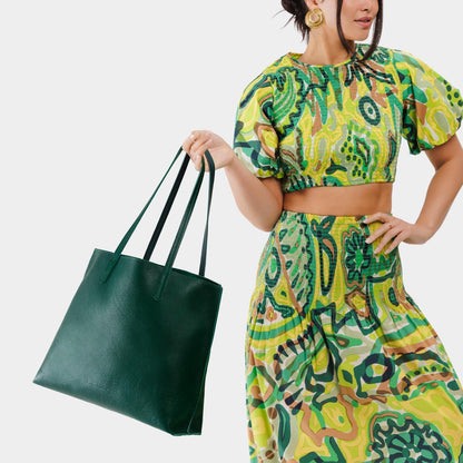Forest Green*Large | Model holding leather tote bag with interior snap key loop