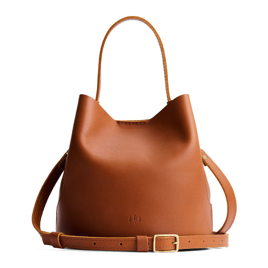 Honey*Large | Symmetrical bucket bag with handle, latch closure, and removable crossbody strap