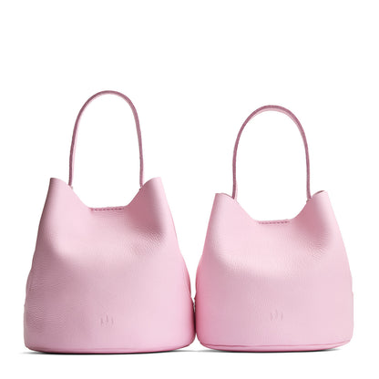 Pinkaboo | Size comparison image of two symmetrical leather bucket bags