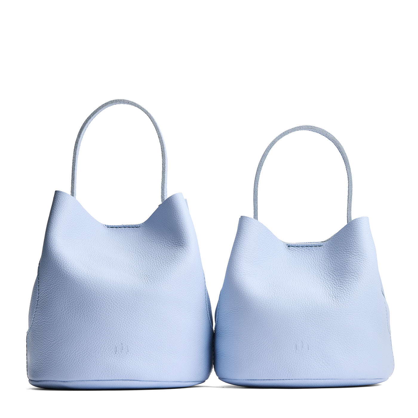 Skyway | Size comparison image of two symmetrical leather bucket bags