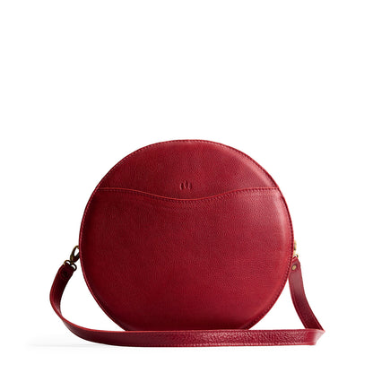 Chili Red | Large circle shaped leather bag with top zipper and carrying strap