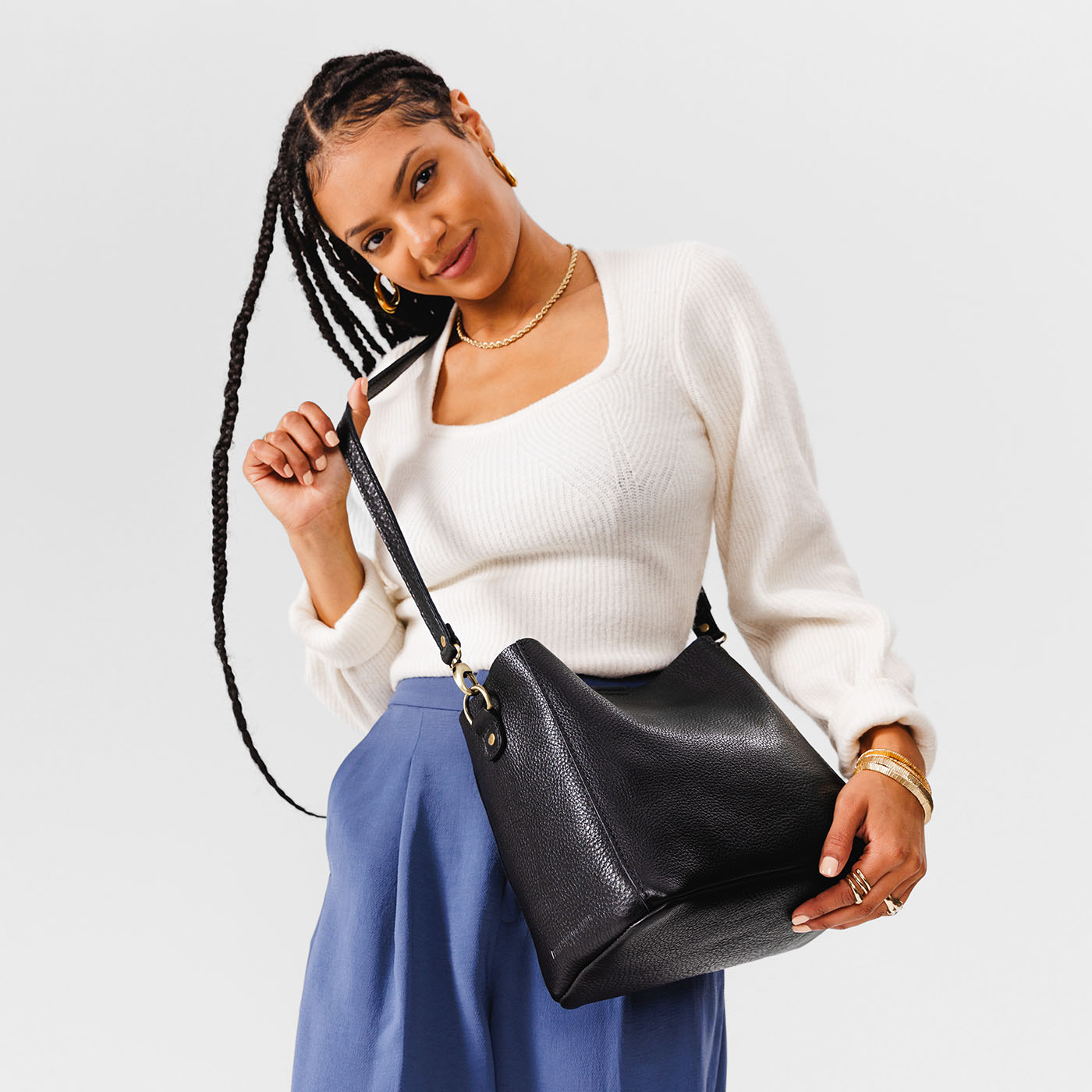 Pebbled--black | symmetrical bucket bag with latch closure and removable crossbody strap