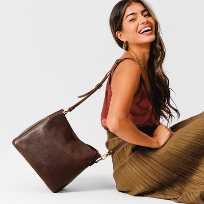 Coldbrew | symmetrical bucket bag with latch closure and removable crossbody strap
