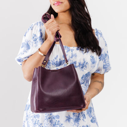 Plum | symmetrical bucket bag with latch closure and removable crossbody strap