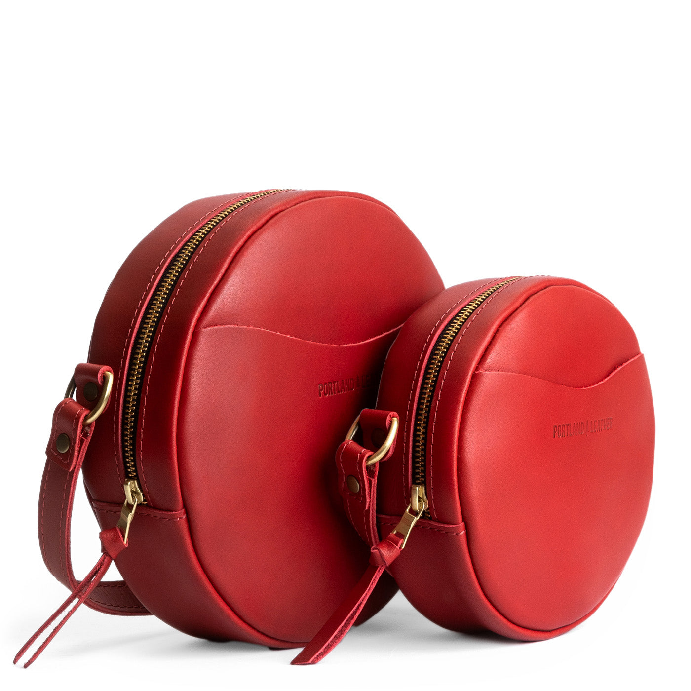 Ruby | Size comparison image of small and large circle shaped crossbody bags with top zipper