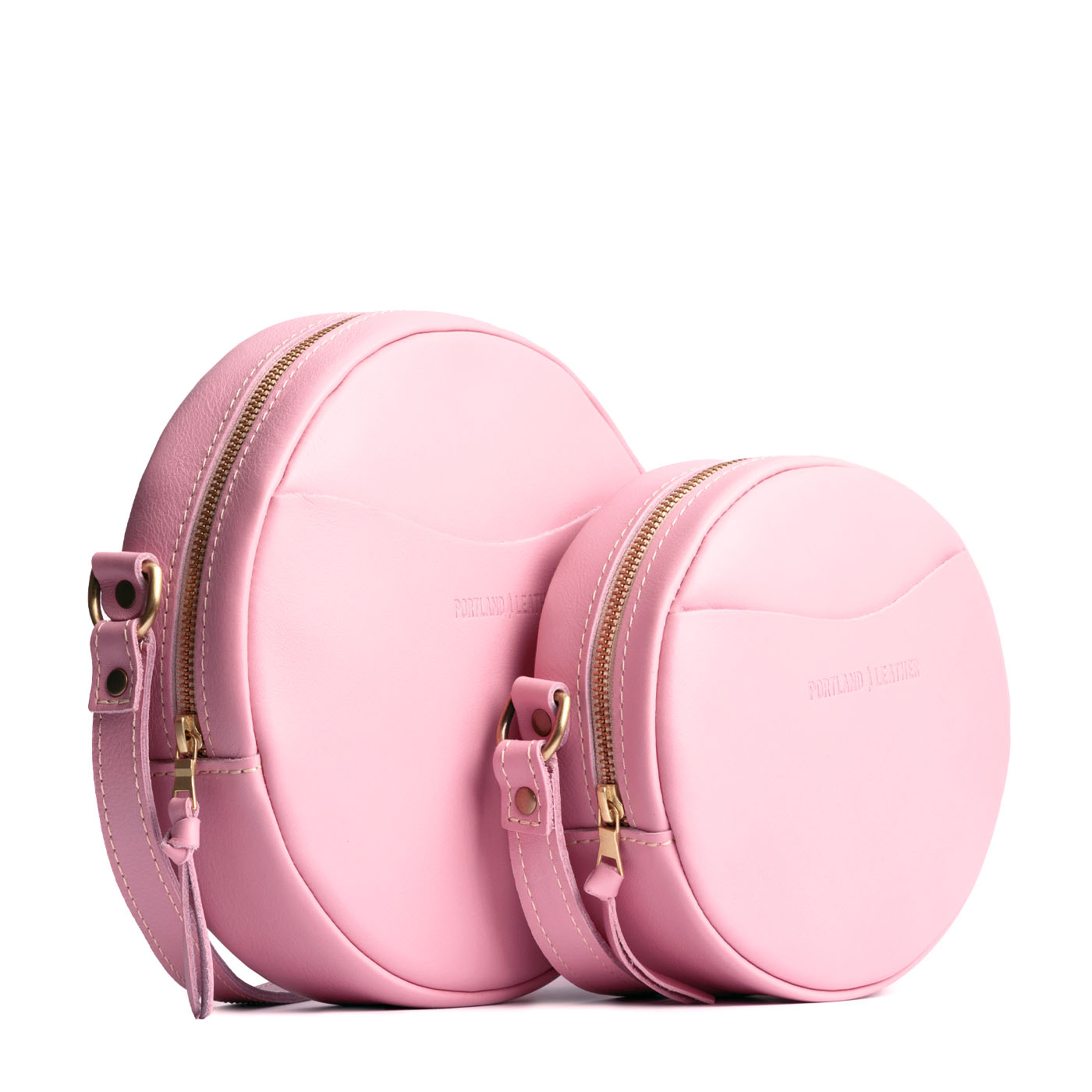 Vintage Pink | Size comparison image of small and large circle shaped crossbody bags with top zipper