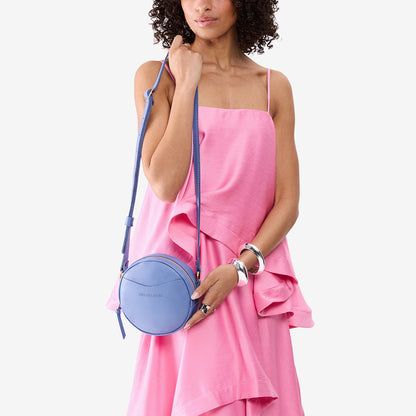 Aster*Small | Model wearing circle shaped crossbody bag with top zipper