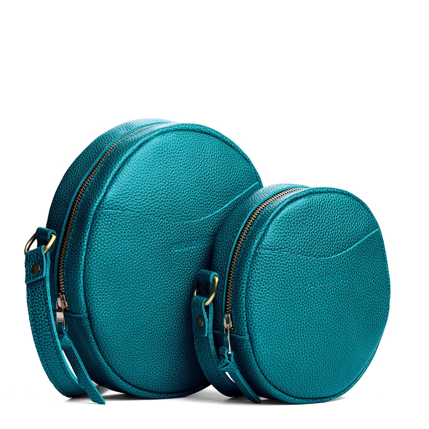 Aquarius | Size comparison image of small and large circle shaped crossbody bags with top zipper