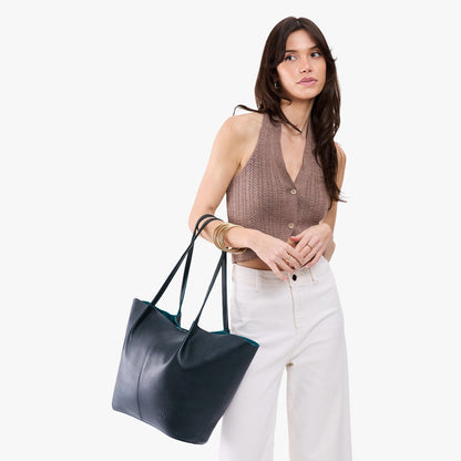 Boreal*Oversized | Model carrying extra wide bucket shaped tote bag with matching leather handles