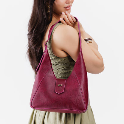 Orchid | Model wearing structured hobo shoulder bag with adjustable strap and magnetic closure