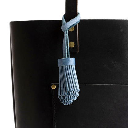 All Color: Indigo | Pom-pom style with tiered leather fringe