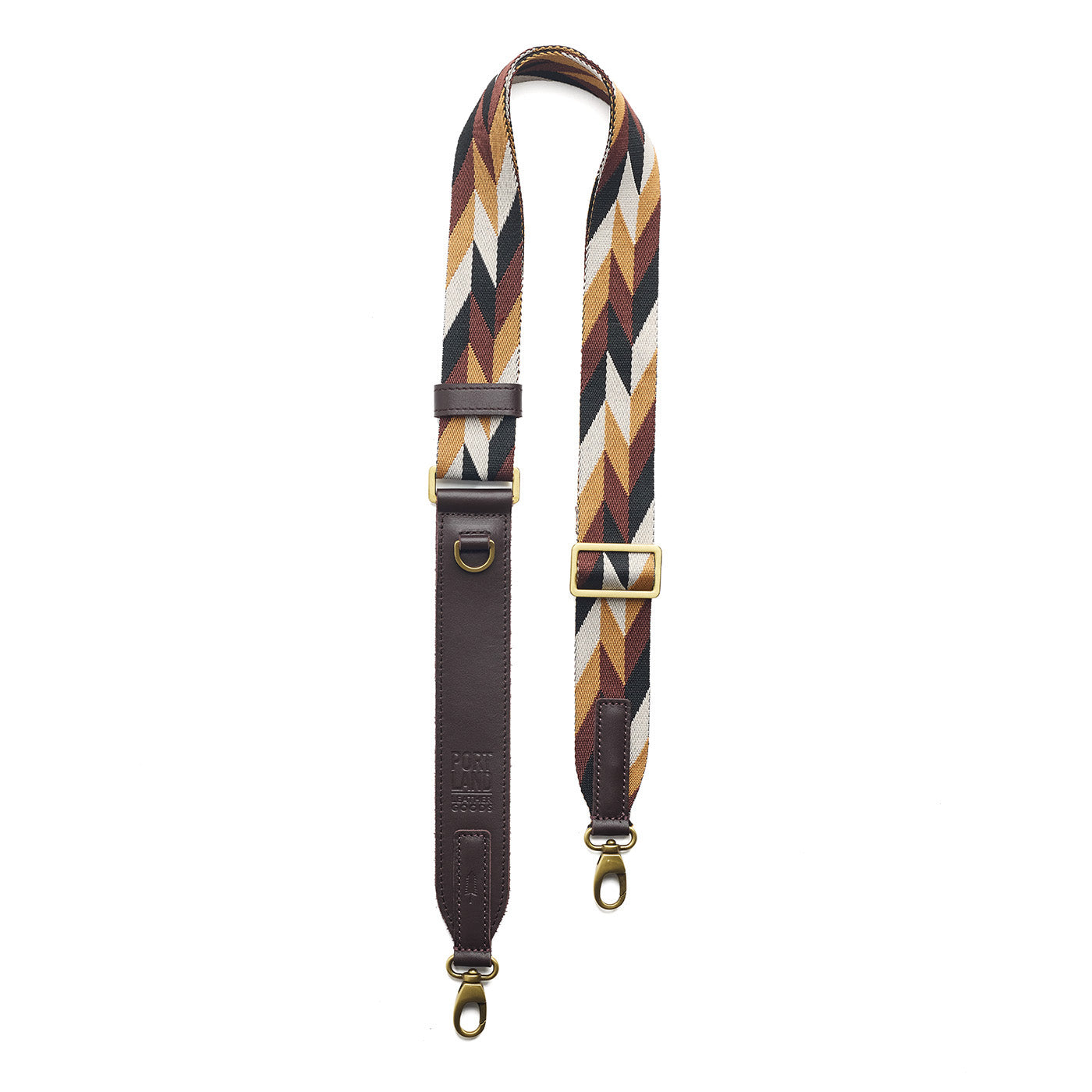 Golden Dusk | Patterned fabric and leather strap on a white background