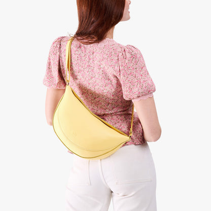 Butter Bliss*Large | Model wearing half circle shaped sling bag