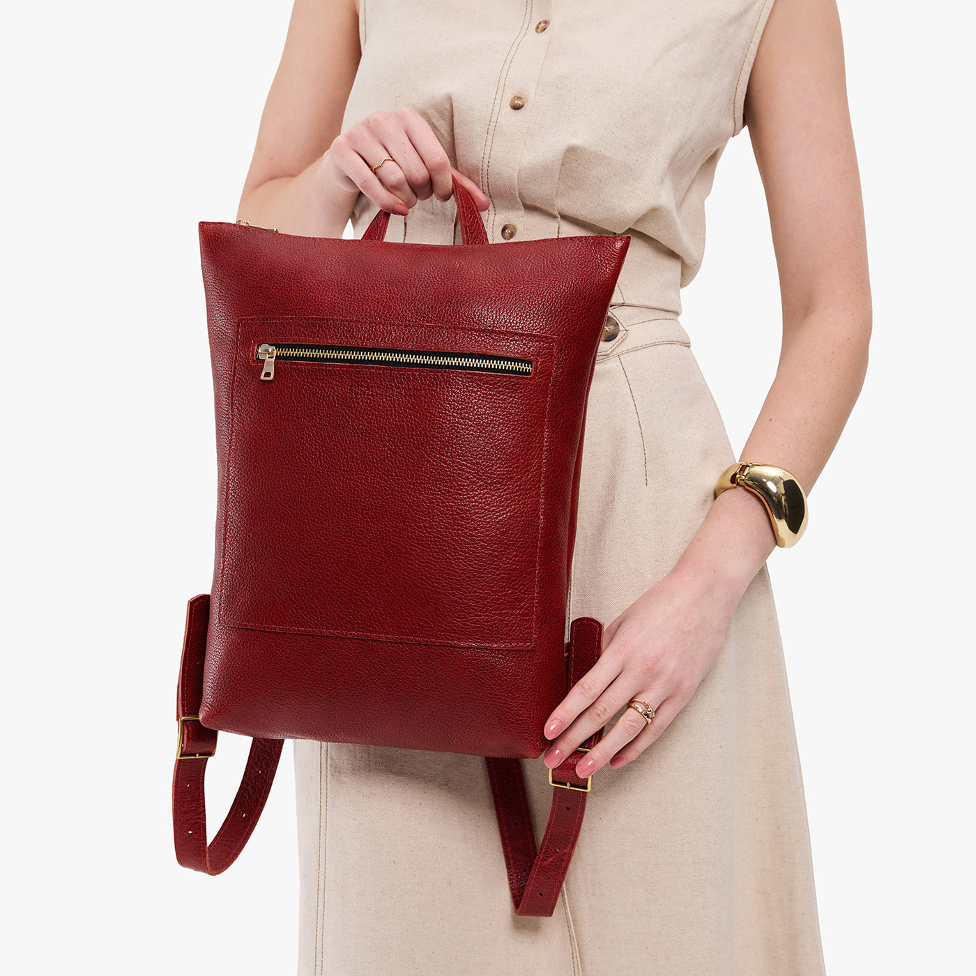 Chili Red | Model wearing rectangular slim leather laptop backpack