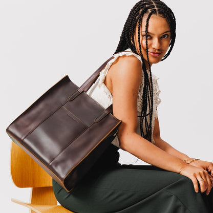 Grizzly*North/South | Model wearing structured large tote bag with overlapping panels and crossbody strap