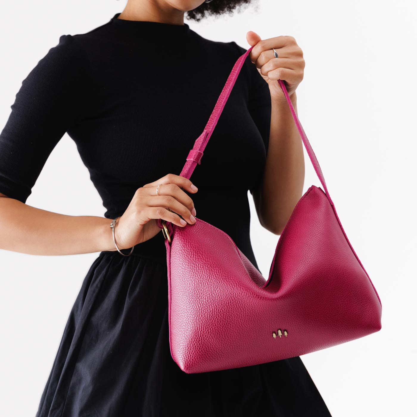 Cosmo*Large | Medium sized slouchy leather shoulder bag with zipper opening and three metal tree emblems