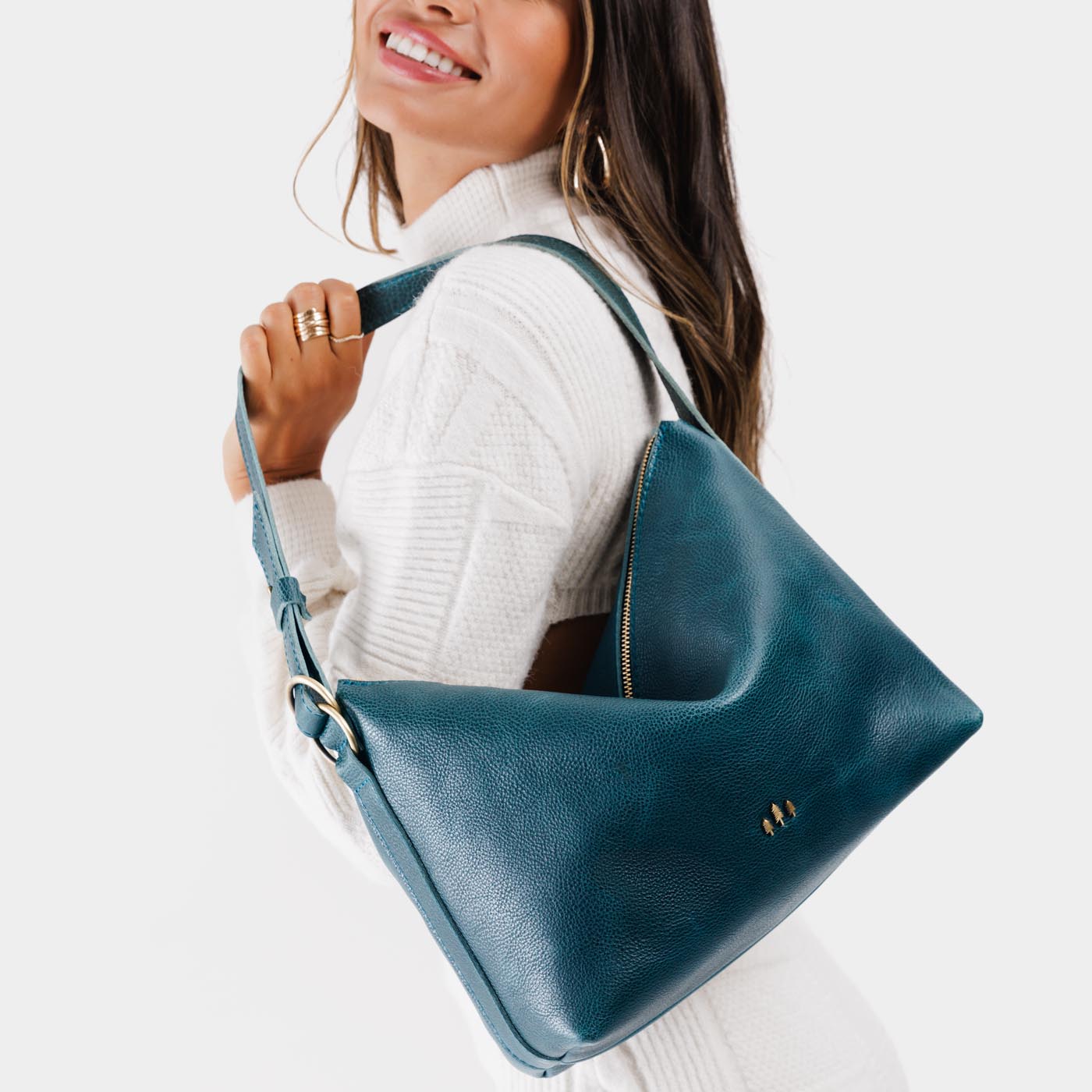 Lagoon*Large | Medium sized slouchy leather shoulder bag with zipper opening and three metal tree emblems