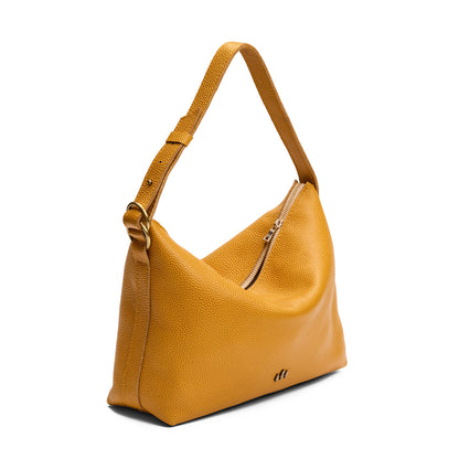 Sunshine*Large | Slouchy Shoulder Bag that has a zipper opening and three metal tree emblems on a white background
