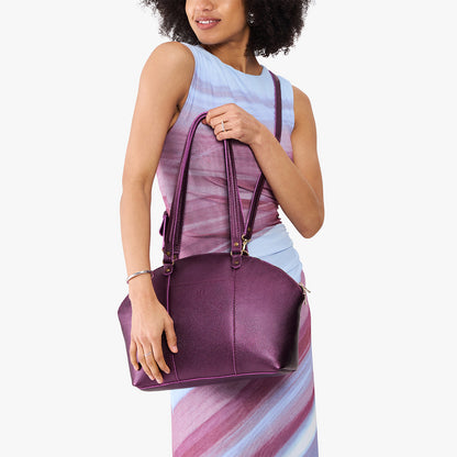 Ultra Violet*Large | Model holding a half circle crossbody bag with handles and removable crossbody strap