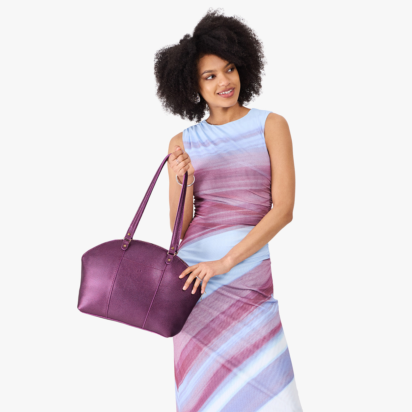 Ultra Violet*Large | Model holding a half circle crossbody bag with handles and removable crossbody strap