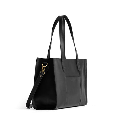 Black*East/West | Structured wide tote bag with overlapping panels and crossbody strap