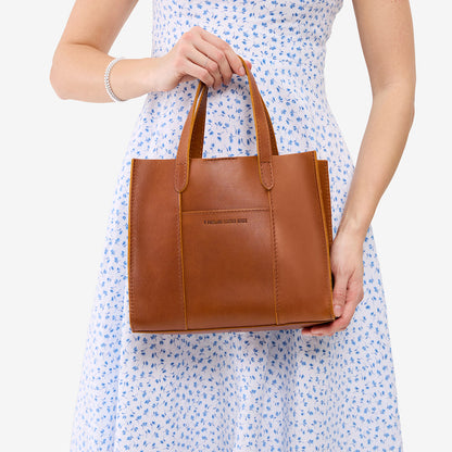 Honey | Structured mid-size tote bag with overlapping panels and crossbody strap