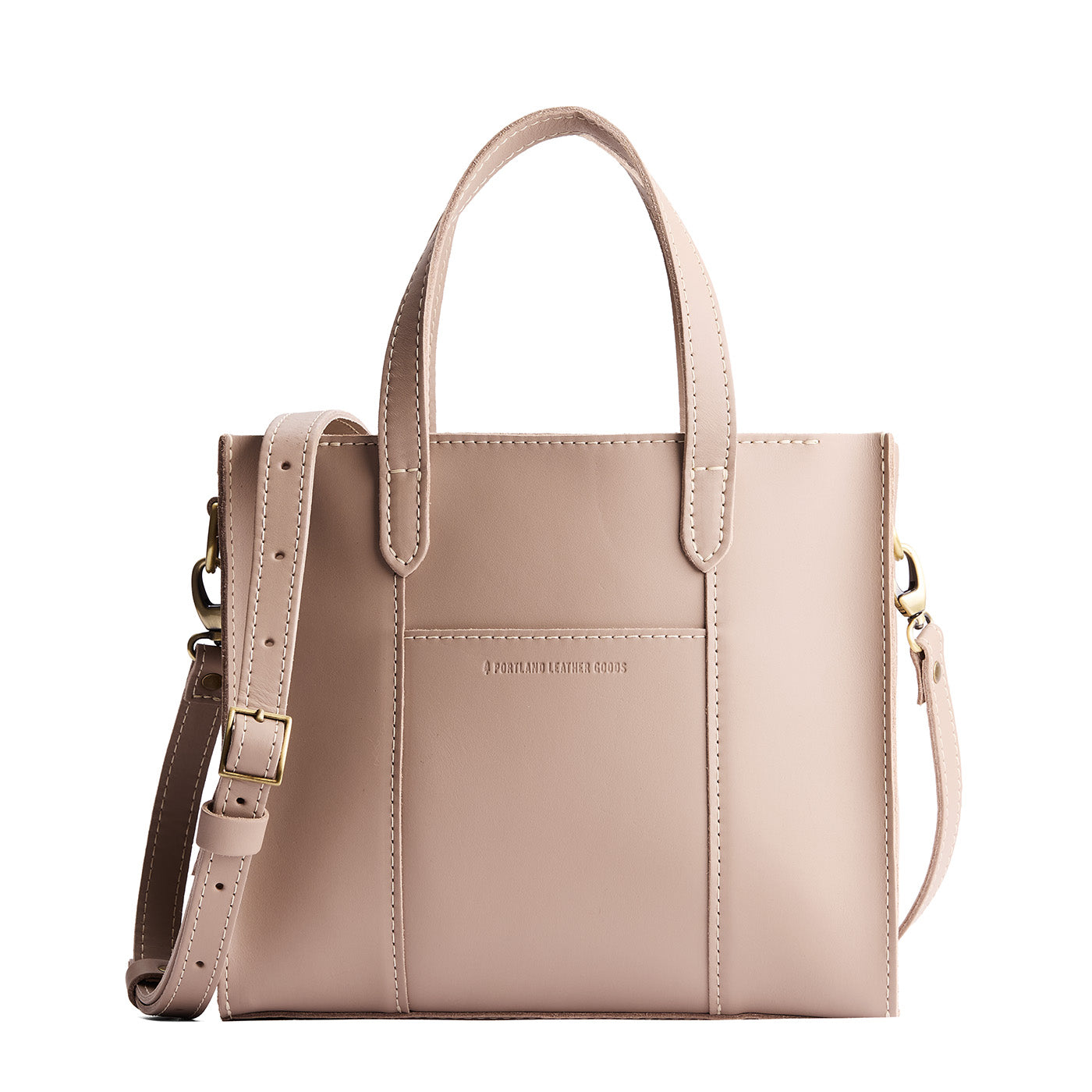 Stone*Zipper | Structured mid-size tote bag with overlapping panels and crossbody strap