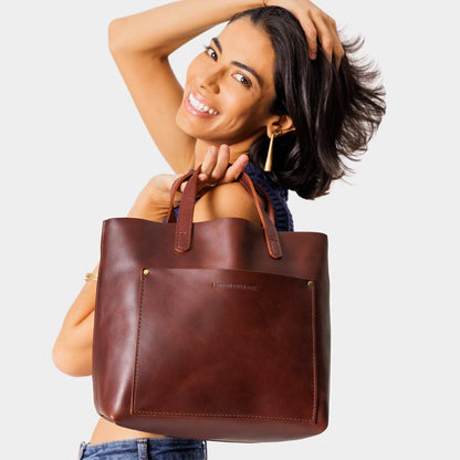 Cognac | Midsize crossbody tote with handles and a pocket