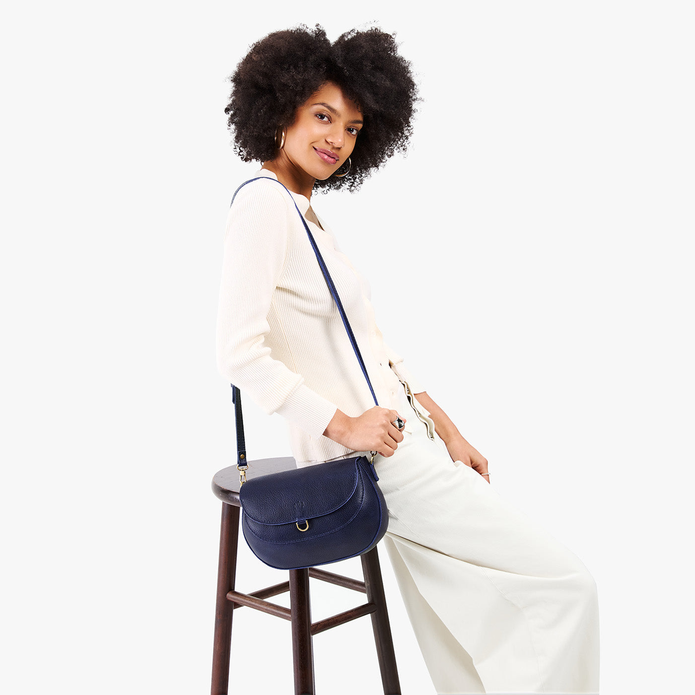 Cobalt*Large | Model wearing a leather Crossbody with a flap and magnetic closure