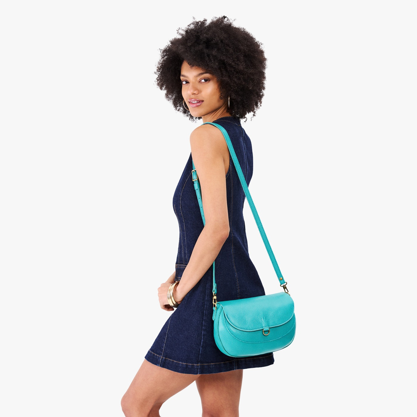 Seafoam*Large | Model wearing a leather Crossbody with a flap and magnetic closure