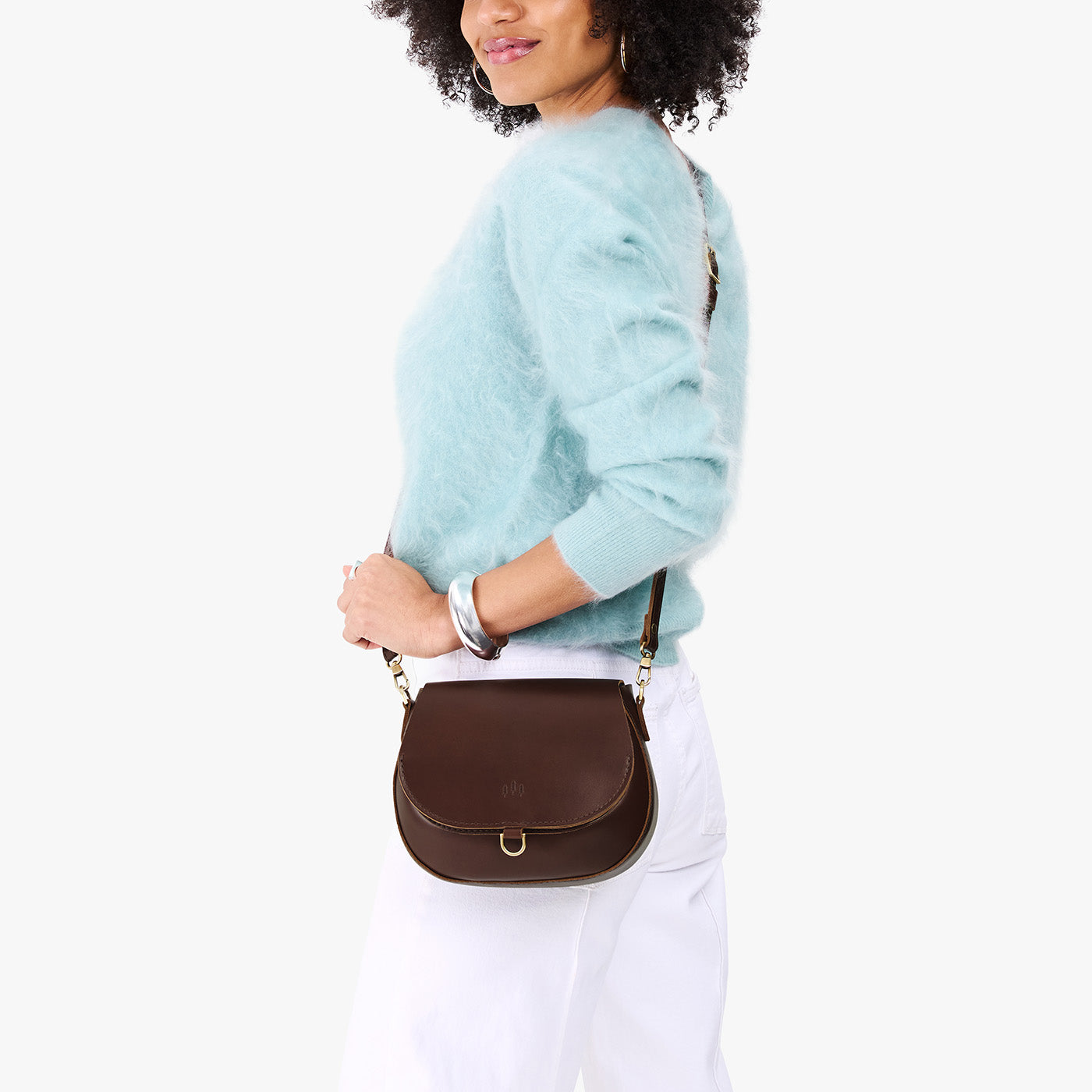 Chocolate Brown*Small | Model wearing a petite leather Crossbody with a flap and magnetic closure