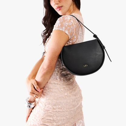 Black | Model wearing a rounded structured shoulder bag