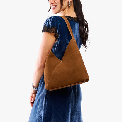 Jackson*Large | Model wearing mid-size shoulder bag with magnetic snap closure