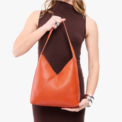 Koi*Large | Model wearing mid-size shoulder bag with magnetic snap