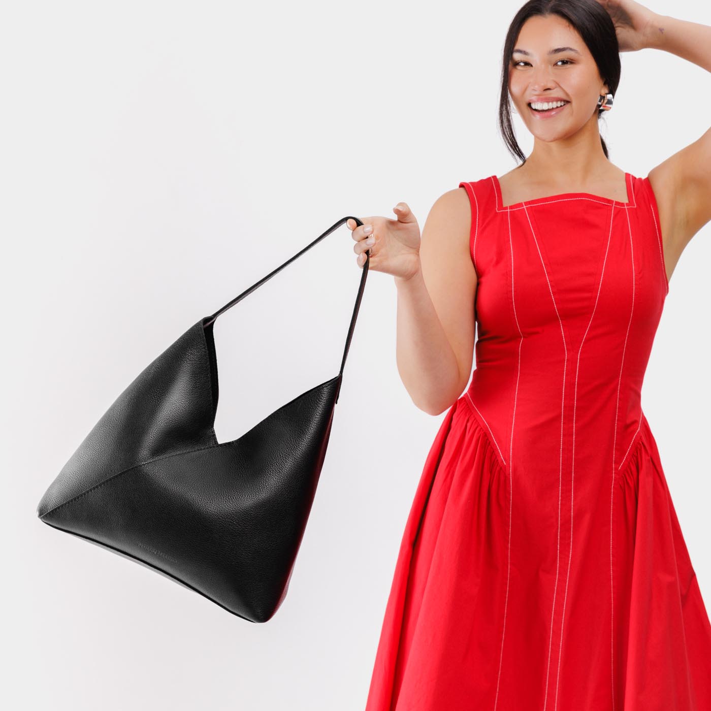 Pebbled--black*Oversized | Model wearing large shoulder bag with magnetic snap closure