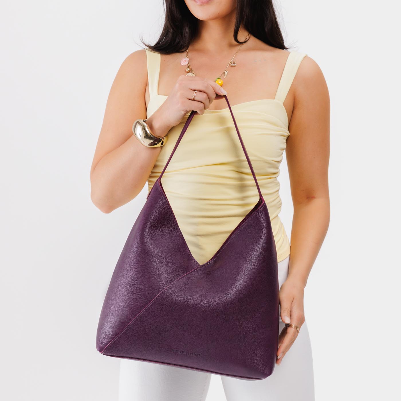 Plum*Oversized | Model wearing large shoulder bag with magnetic snap closure