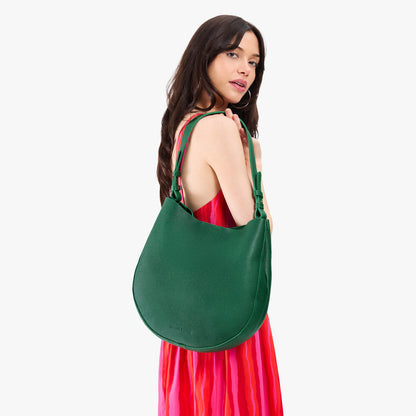 Bacalar*Large | Model holding round leather purse with adjustable shoulder strap