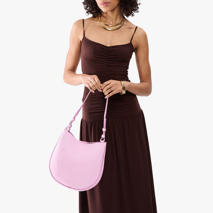 Pinkaboo*Medium | Model holding round leather purse with adjustable shoulder strap