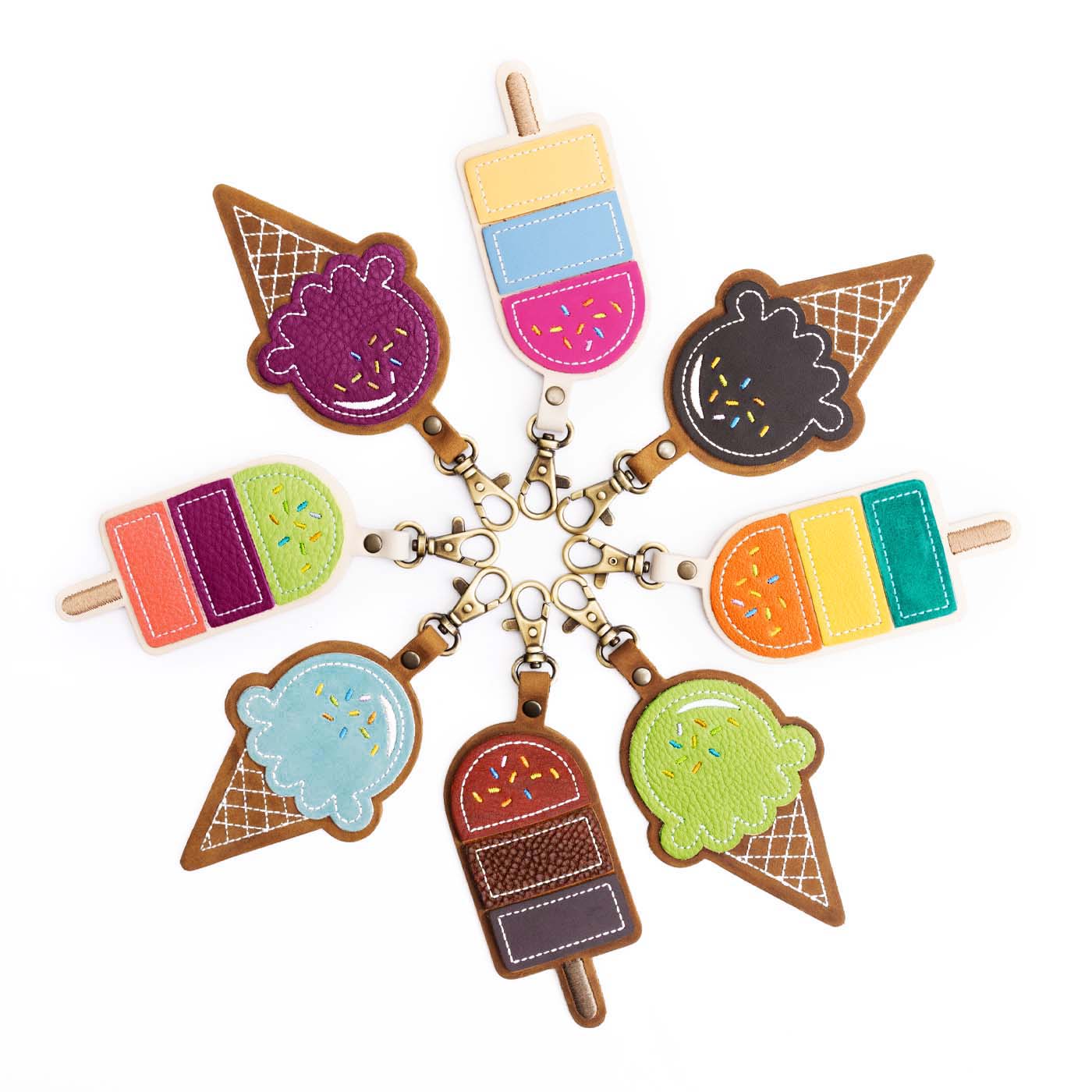 Popsicle and Ice cream cone keychains organized in a circle