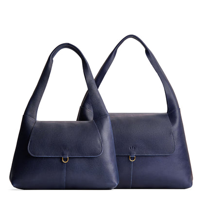 Cobalt | Comparison image of a slouchy triangle shaped shoulder bag with a flap