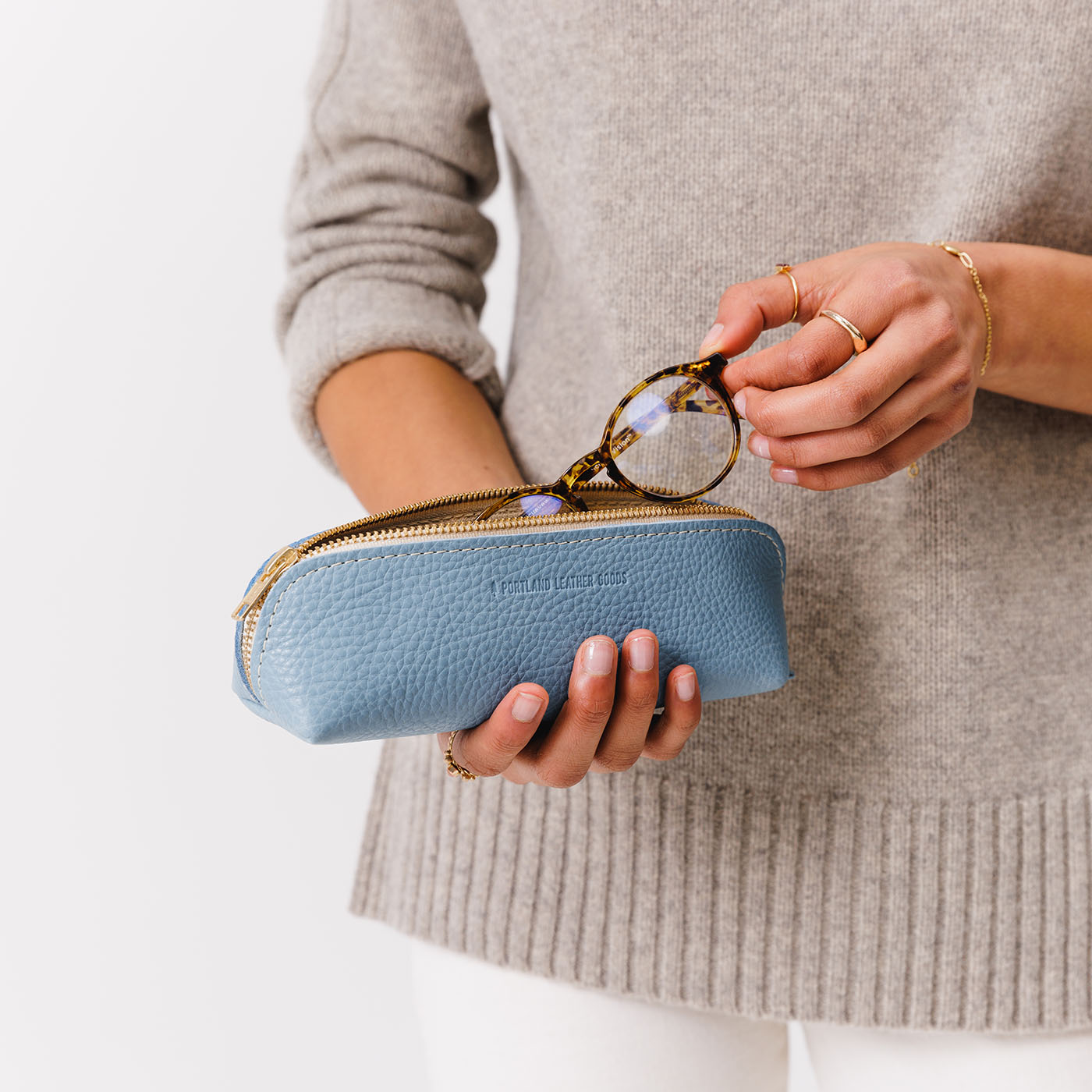 All Color: Dream | Leather pouch with curved seams and top zipper