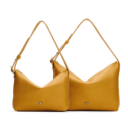 Sunshine | Size comparison shot of small and large slouchy shoulder bags with zipper opening and three metal tree emblems