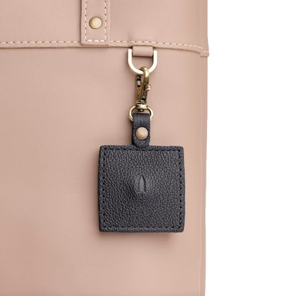 Pebbled--black | Square-shaped leather AirTag holder with snap closure and swivel lobster claw clasp