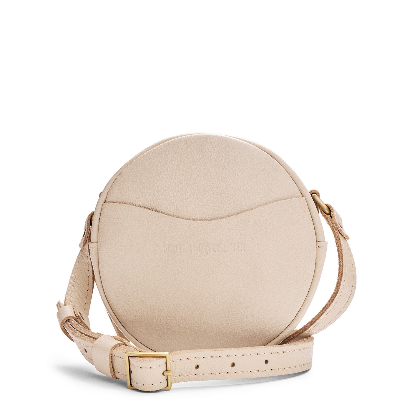 Pebbled Bone | Circle shaped crossbody bag with top zipper and gold accents