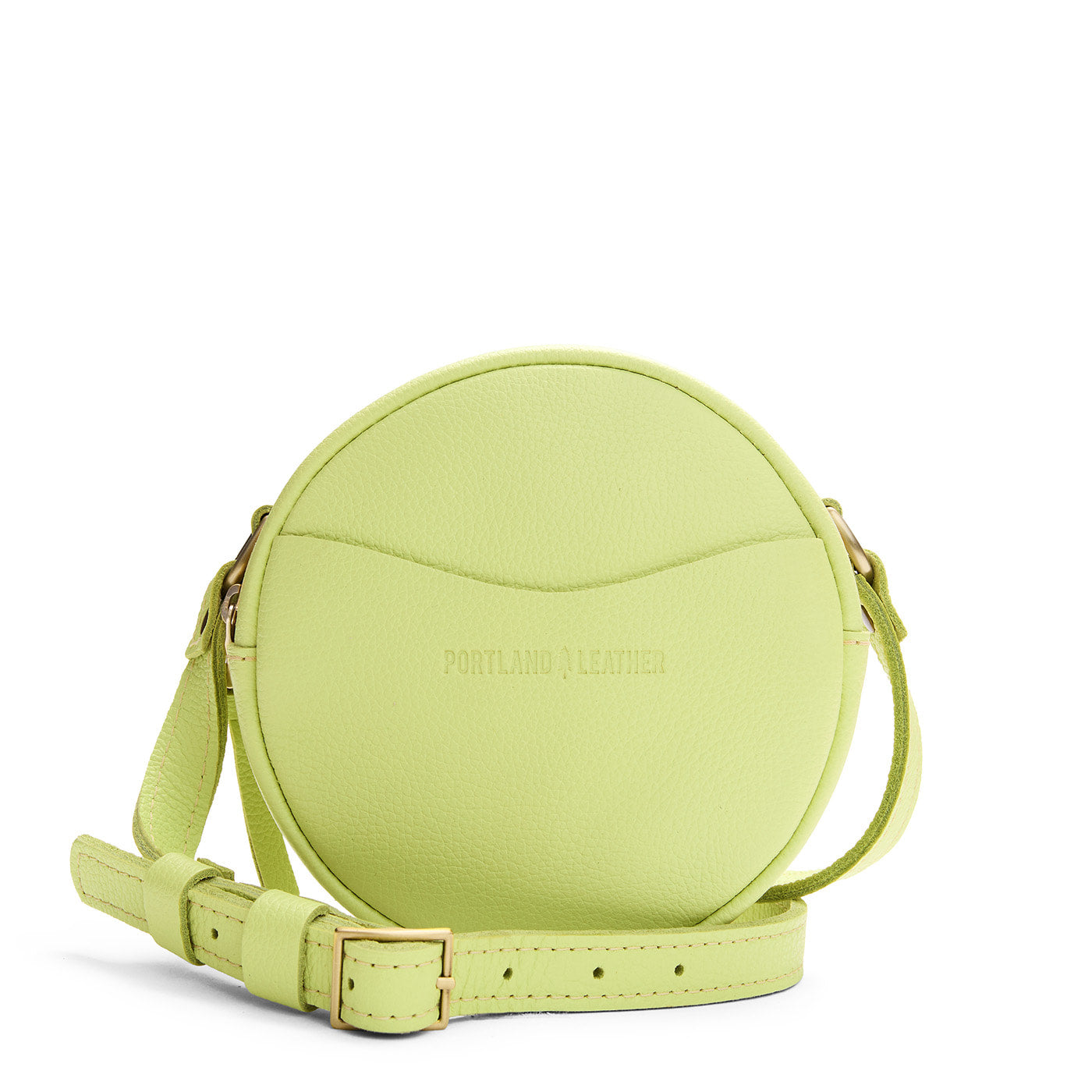 Shadow Lime | Circle shaped crossbody bag with top zipper and gold accents