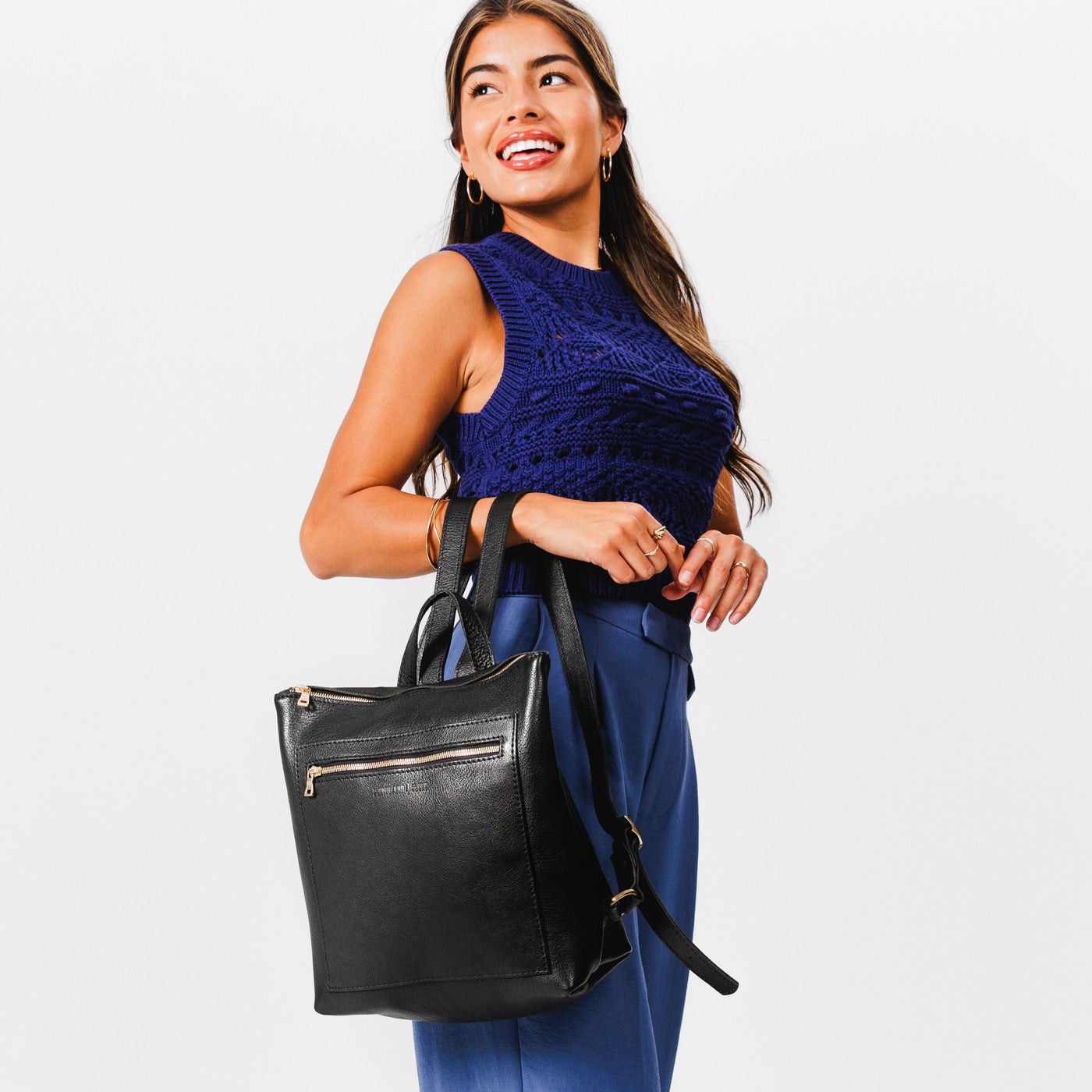 All Color: Pebbled--black*Classic | Model holding square slim leather tote backpack