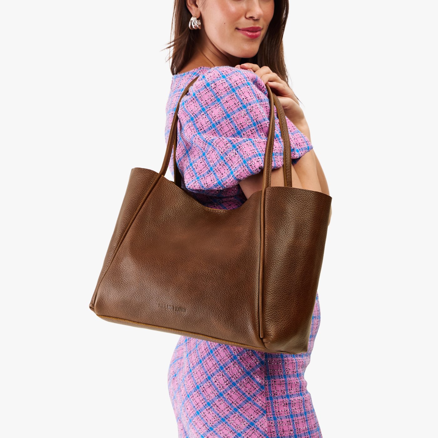 Asheville*Large | Woman holding a wide tote with leather straps and snap closure